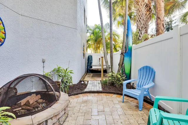 a view of a chair and table in the patio
