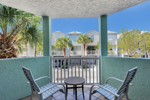 a view of a chair and table in the balcony