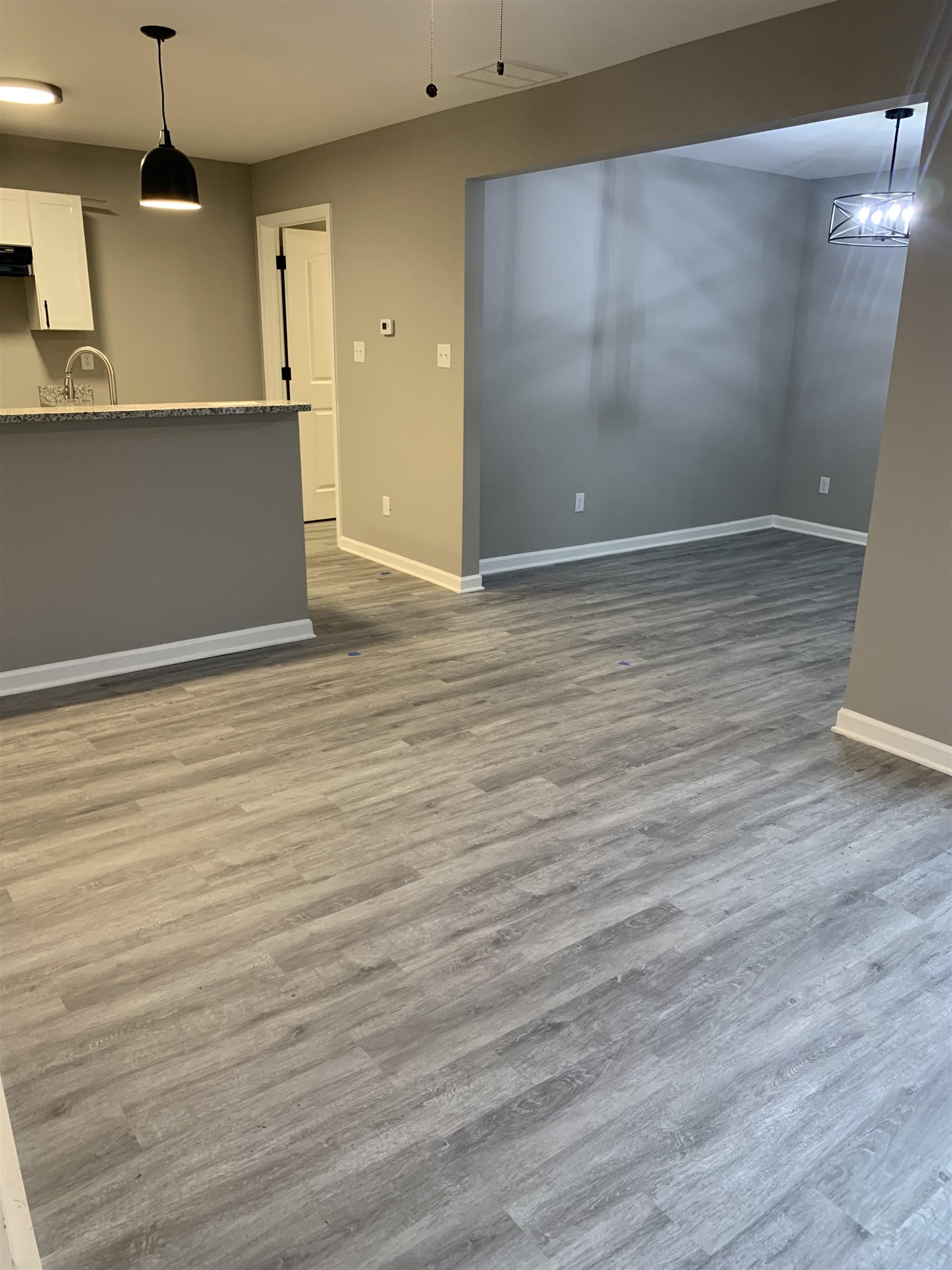4372 Ryan Street Memphis, TN 38127 - Photo 4 of 9 Unfurnished living room with dark wood-style flooring