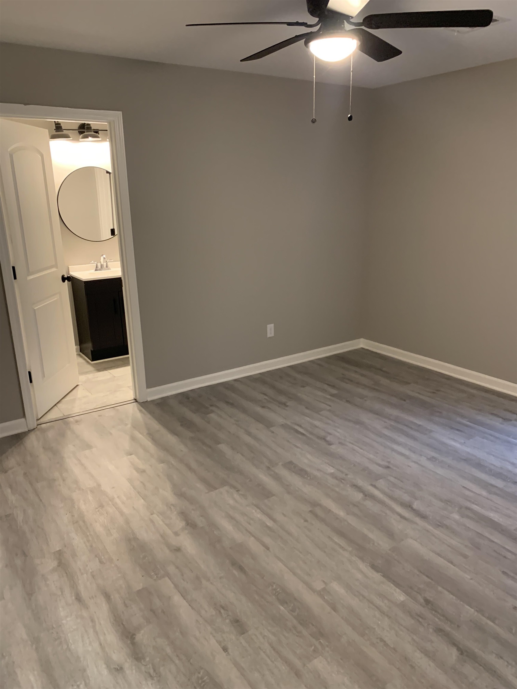 4372 Ryan Street Memphis, TN 38127 - Photo 7 of 9 Empty room featuring light wood-style flooring and a ceiling fan