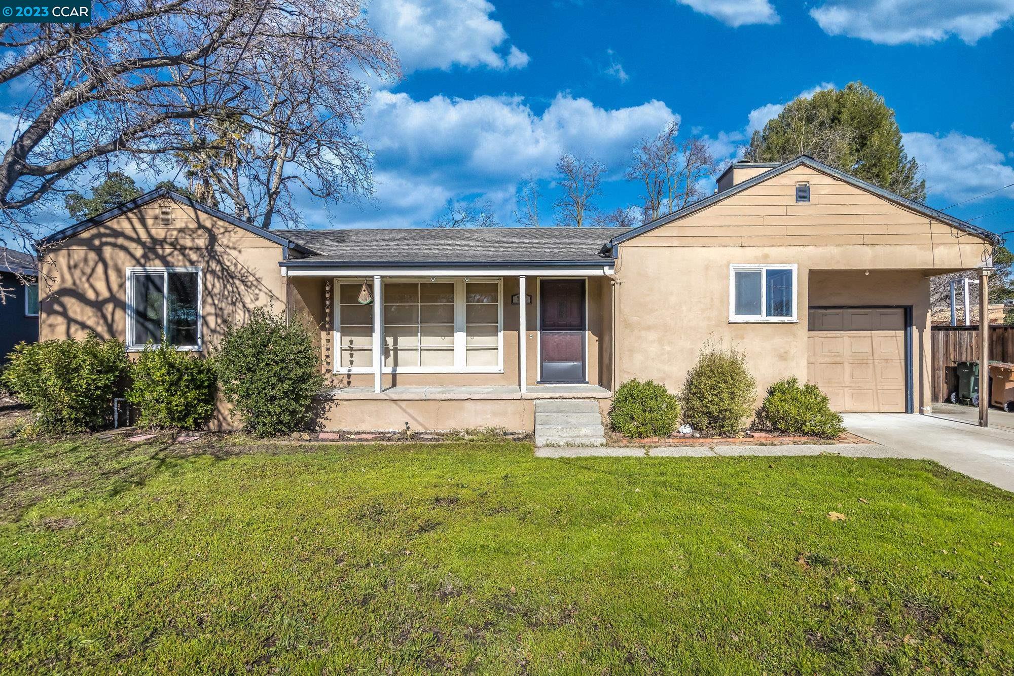 703 Grayson Road Pleasant Hill, CA 94523 - Photo 1 of 1 a front view of a house with a yard