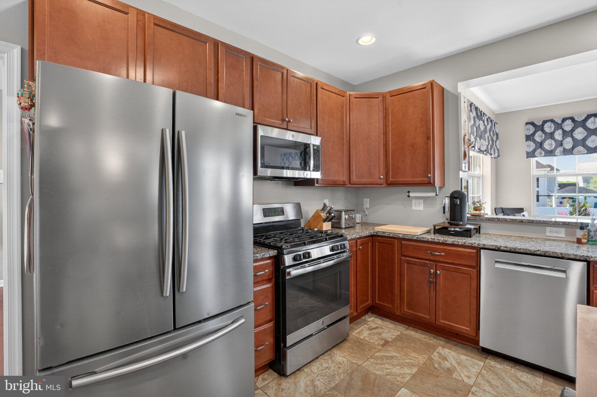 1105 Cardigan Road Middletown, DE 19709 - Photo 17 of 65 Modern kitchen with warm wood tones.