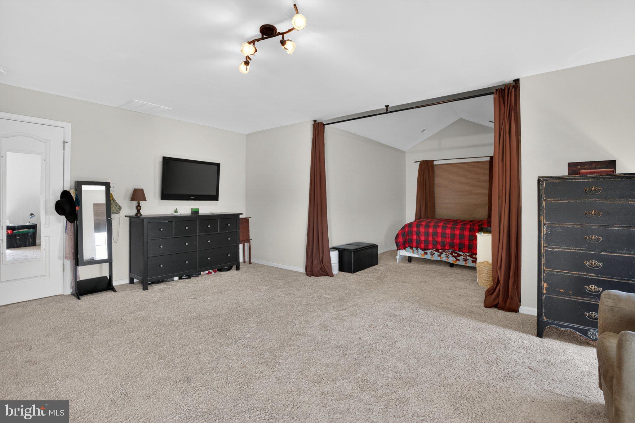 1105 Cardigan Road Middletown, DE 19709 - Photo 34 of 65 Spacious primary bedroom retreat with cozy charm.