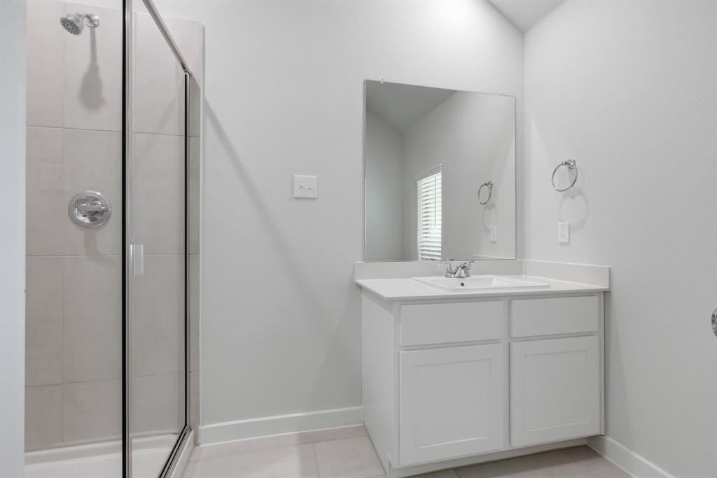 637 Sierra Ridge Lavon, TX 75166 - Photo 19 of 26 a bathroom with a double vanity sink and mirror