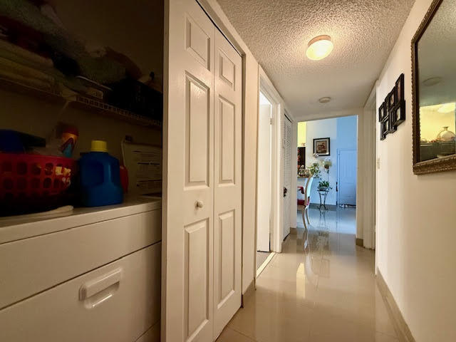 741 Lyons Road, Unit 17201 Coconut Creek, FL 33063 - Photo 22 of 45 a view of a hallway and a livingroom with furniture