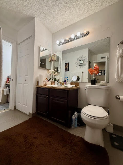 741 Lyons Road, Unit 17201 Coconut Creek, FL 33063 - Photo 26 of 45 a bathroom with a sink toilet and mirror