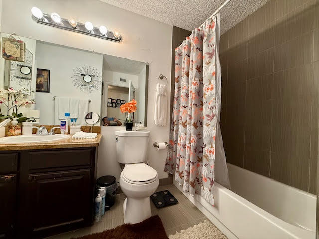 741 Lyons Road, Unit 17201 Coconut Creek, FL 33063 - Photo 27 of 45 a bathroom with a sink toilet and shower