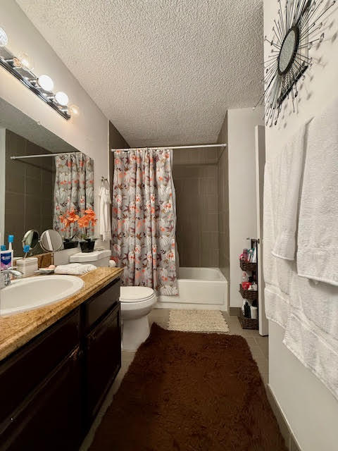 741 Lyons Road, Unit 17201 Coconut Creek, FL 33063 - Photo 32 of 45 a bathroom with a double vanity sink toilet and shower