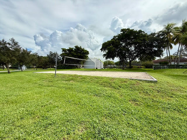 741 Lyons Road, Unit 17201 Coconut Creek, FL 33063 - Photo 37 of 45 a view of a golf course with a lake