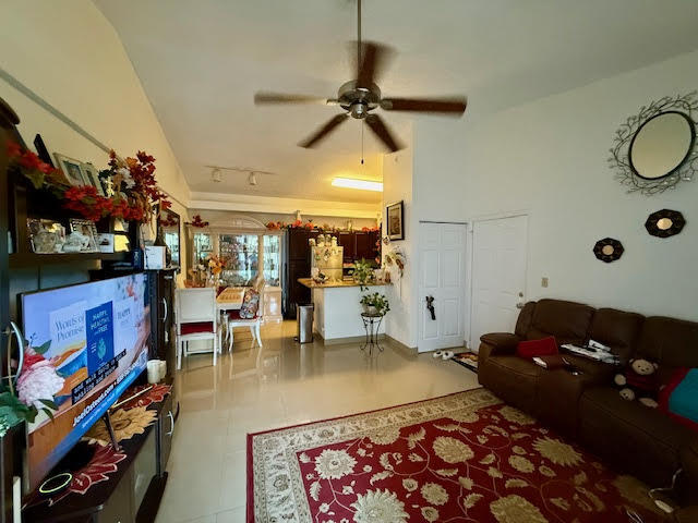 741 Lyons Road, Unit 17201 Coconut Creek, FL 33063 - Photo 45 of 45 a living room with lots of furniture and a rug