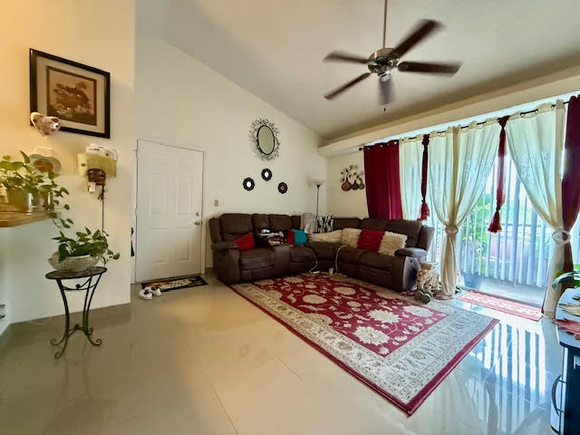 741 Lyons Road, Unit 17201 Coconut Creek, FL 33063 - Photo 7 of 45 a living room with furniture and a rug