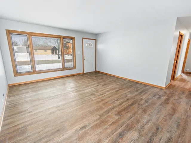 a view of an empty room with glass door