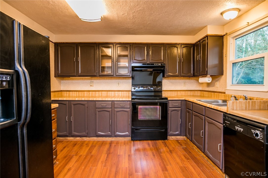 1136 Oldbury Road Midlothian, VA 23113 - Photo 9 of 36 a kitchen with stainless steel appliances granite countertop a refrigerator and a sink