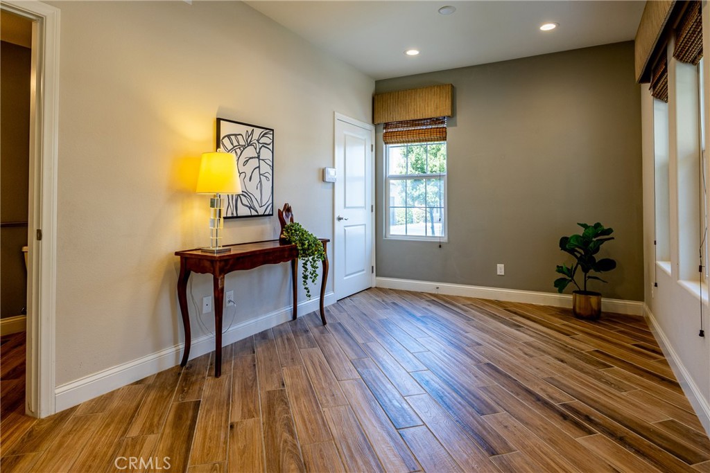 9369 Riberena Circle Atascadero, CA 93422 - Photo 8 of 48 Stepping into the home you area greeted by wood looking tile floors that flow throughout the entire main floor.