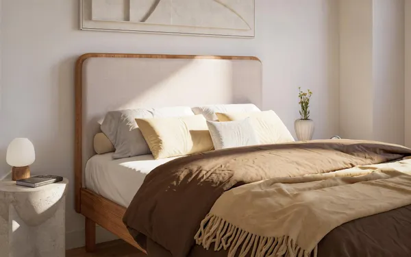 a bedroom with a bed and window