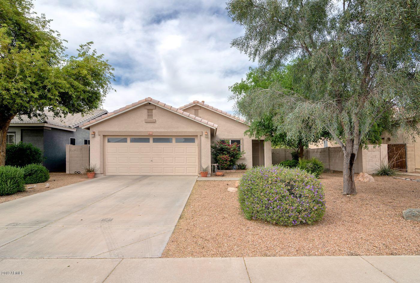 2908 East Harwell Road Gilbert, AZ 85234 - Photo 1 of 38 a view of a house with a yard and large tree