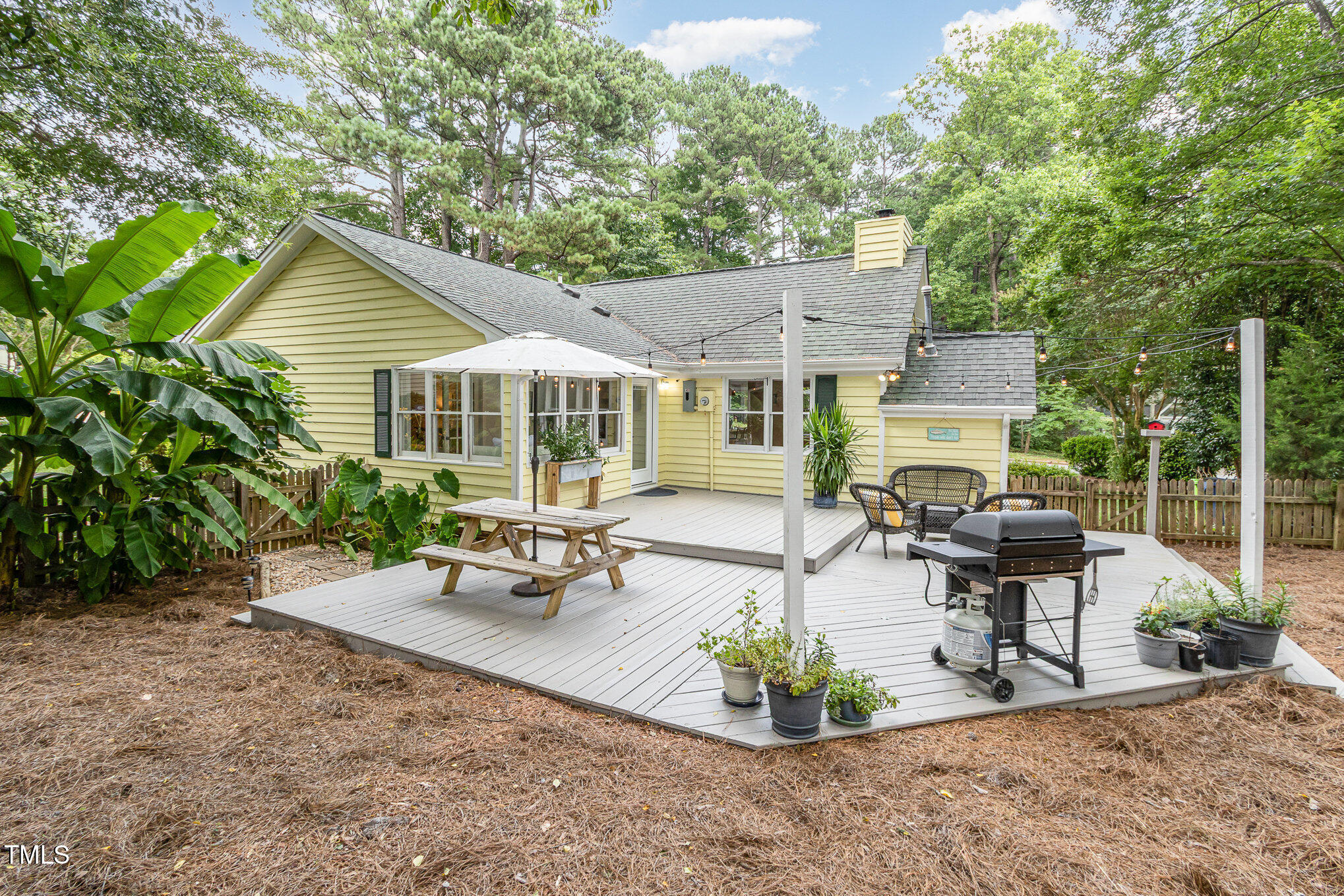 6025 Tarnhour Court Raleigh, NC 27612 - Photo 1 of 27 a view of a house with backyard and sitting area