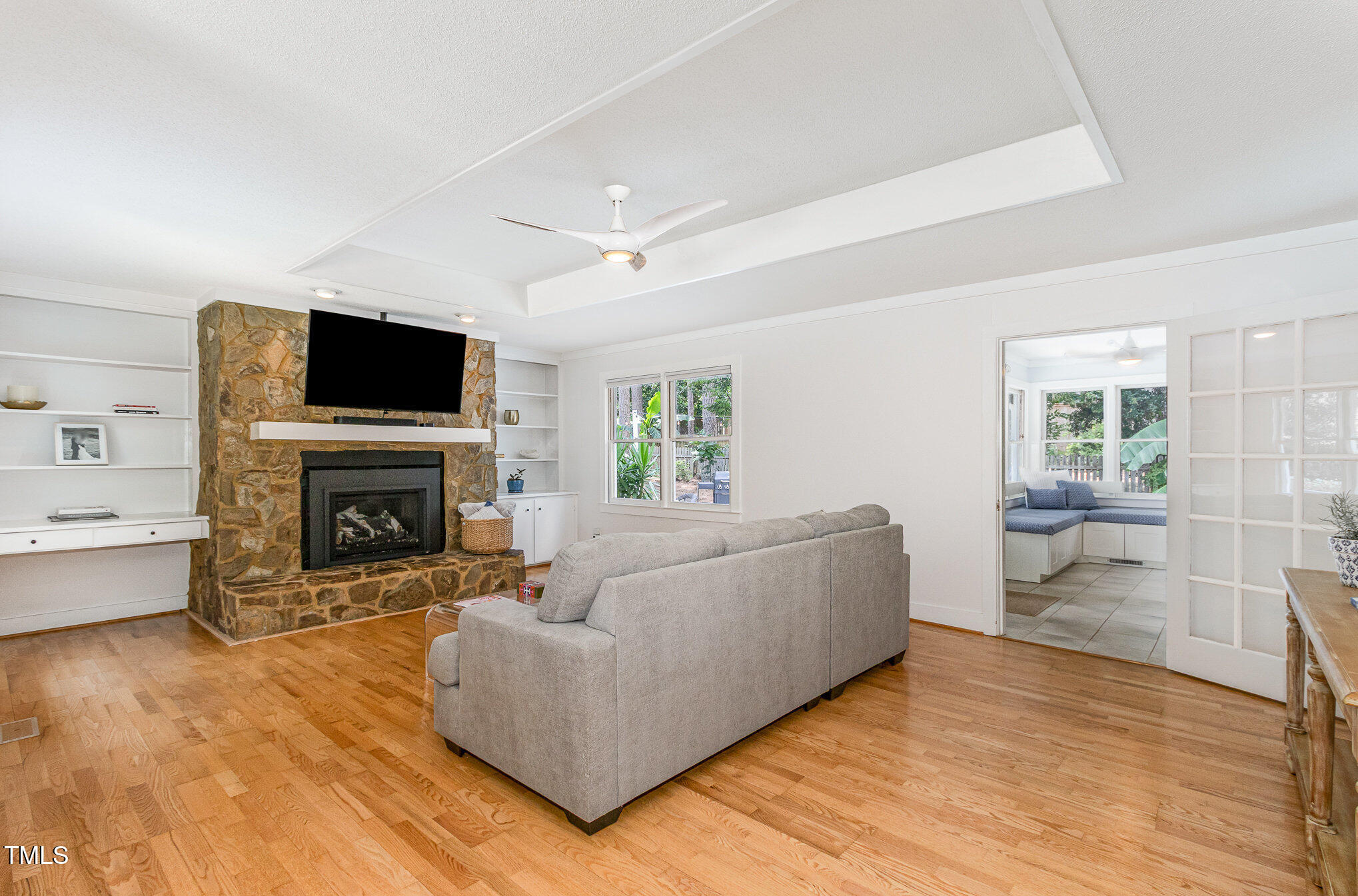 6025 Tarnhour Court Raleigh, NC 27612 - Photo 11 of 27 a living room with furniture and a fireplace