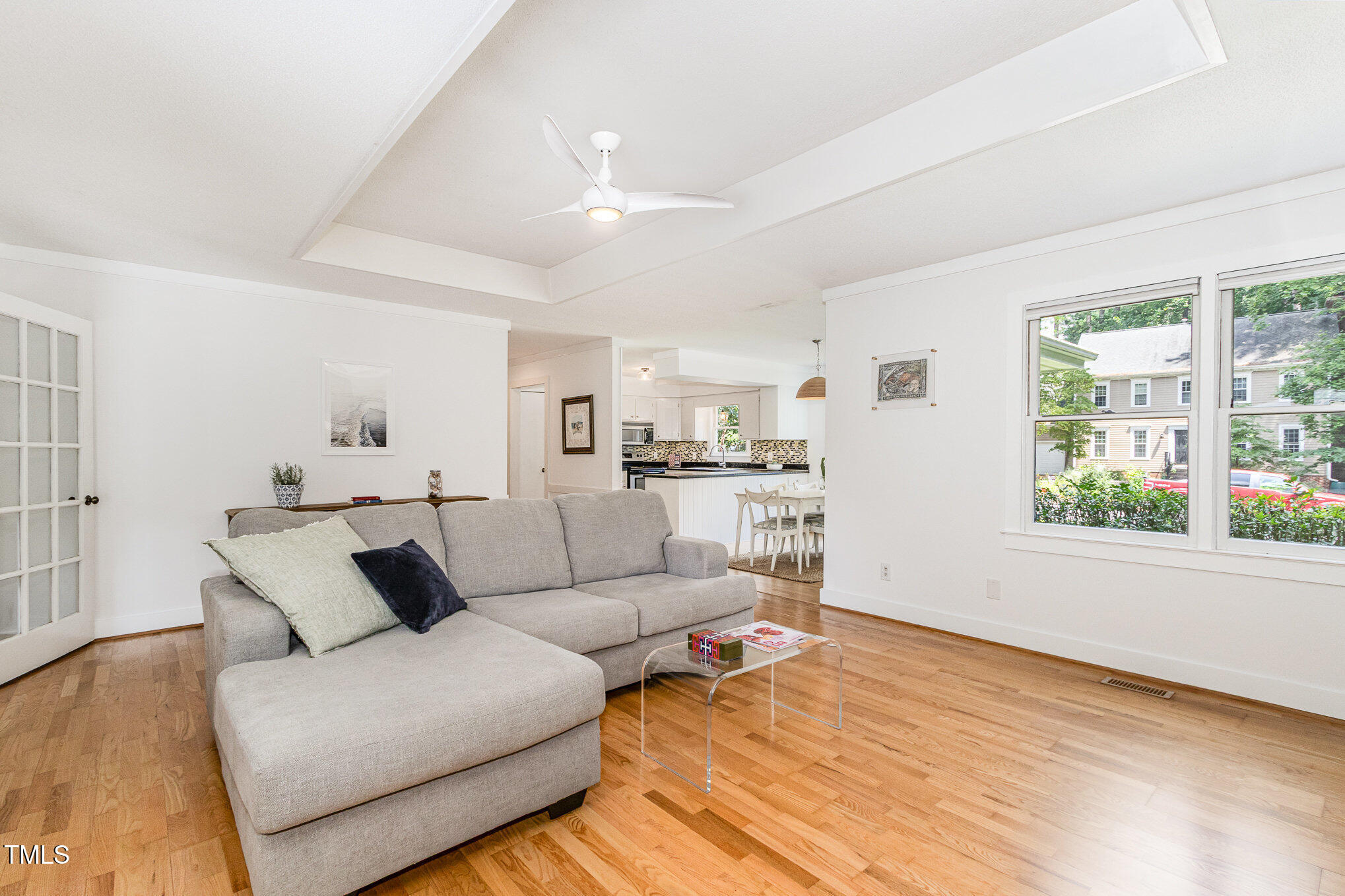 6025 Tarnhour Court Raleigh, NC 27612 - Photo 13 of 27 a living room with furniture and a large window