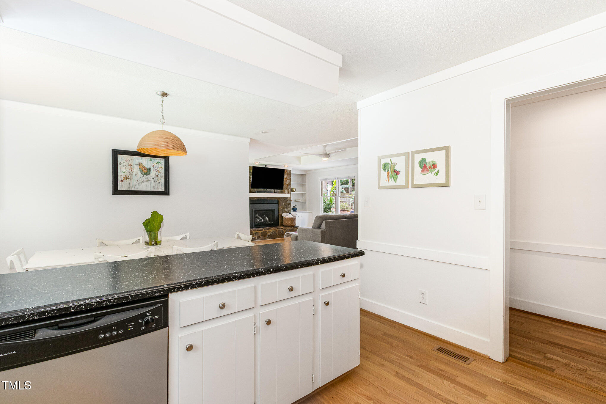6025 Tarnhour Court Raleigh, NC 27612 - Photo 17 of 27 a kitchen with a sink and a refrigerator