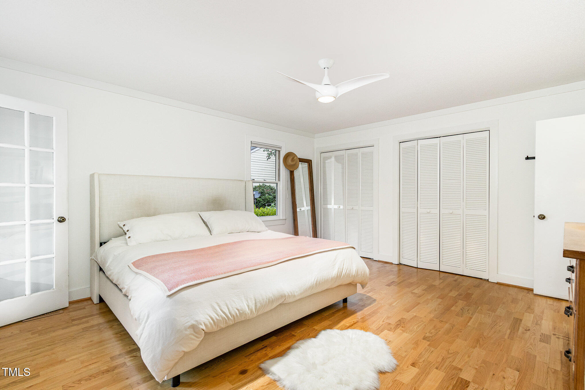 6025 Tarnhour Court Raleigh, NC 27612 - Photo 19 of 27 a large bed sitting in a bedroom and closet