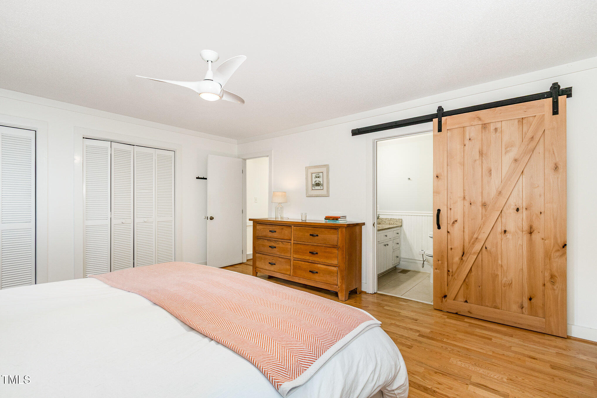 6025 Tarnhour Court Raleigh, NC 27612 - Photo 22 of 27 a bedroom with a bed and a dresser