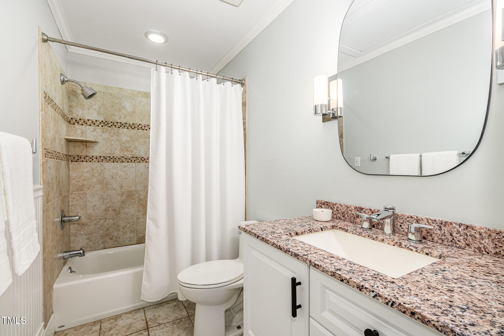 6025 Tarnhour Court Raleigh, NC 27612 - Photo 25 of 27 a bathroom with a granite countertop sink toilet and shower