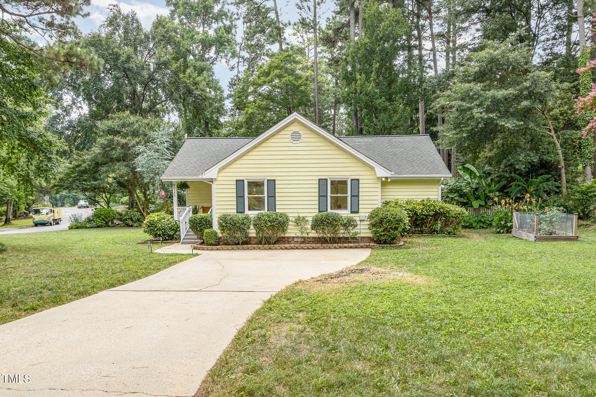 6025 Tarnhour Court Raleigh, NC 27612 - Photo 6 of 27 a front view of a house with a yard