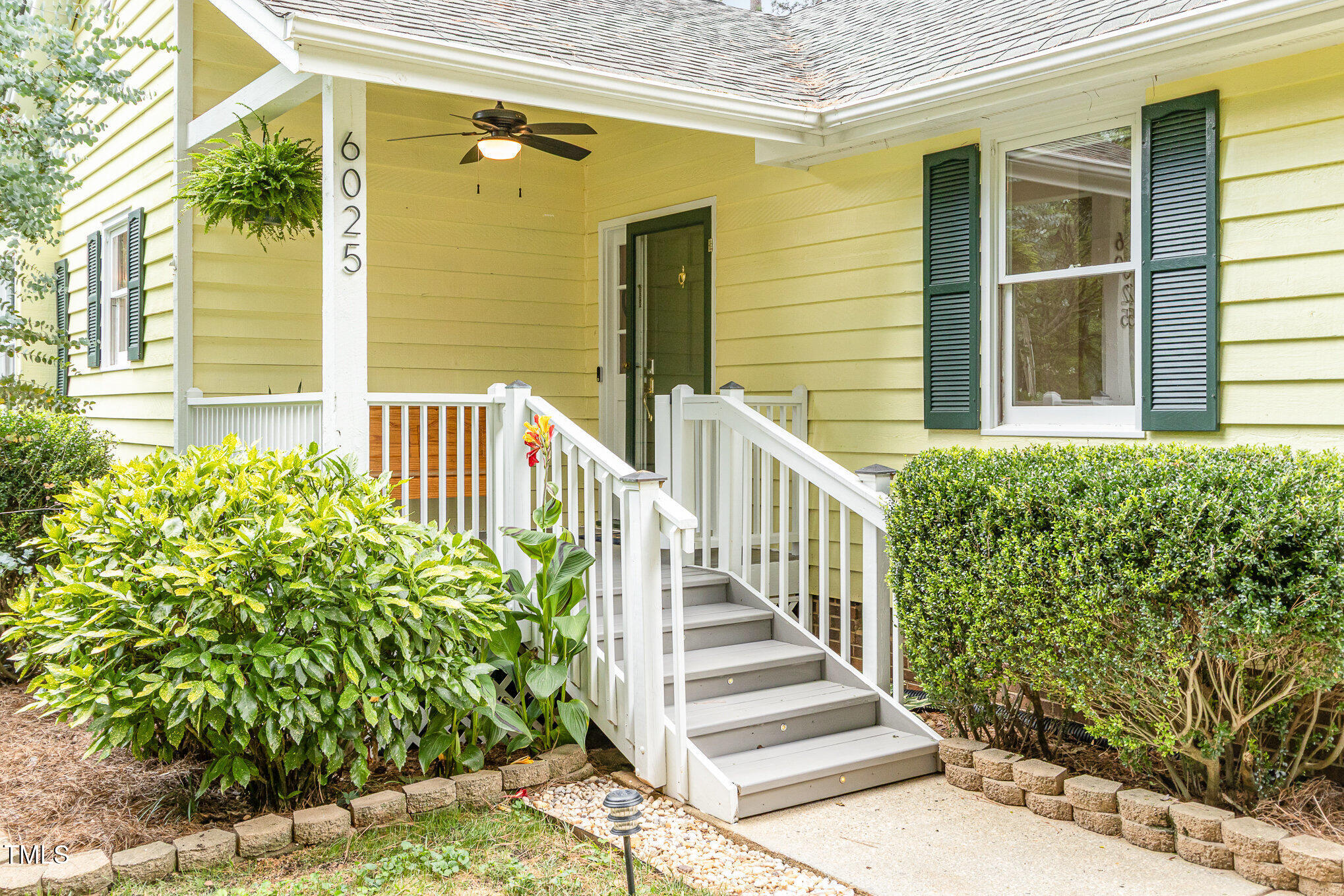 6025 Tarnhour Court Raleigh, NC 27612 - Photo 7 of 27 a view of a house with a flower plants