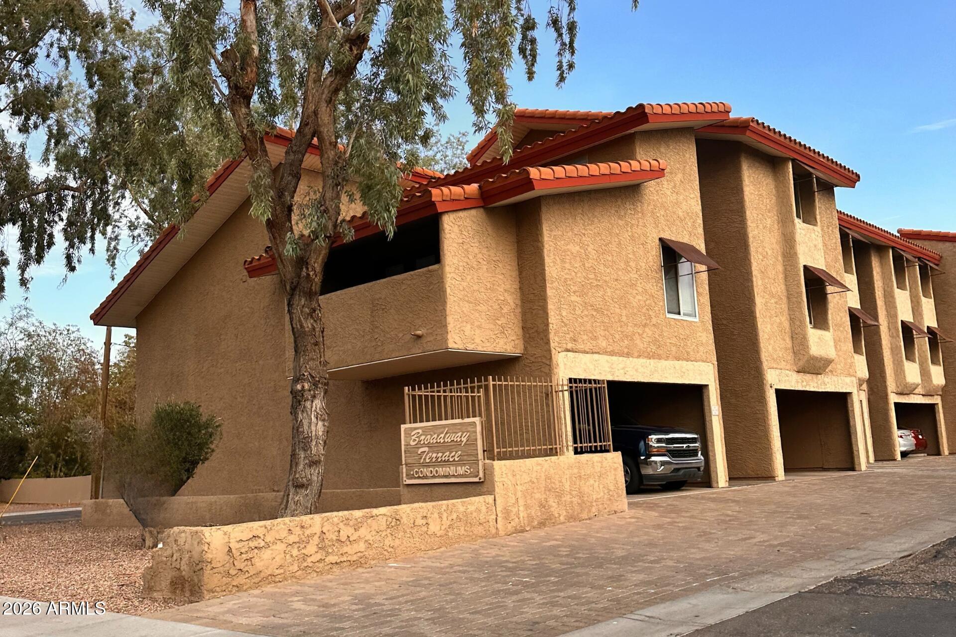 151 East Broadway Road, Unit 103 Tempe, AZ 85282 - Photo 20 of 20 a view of a house with a yard