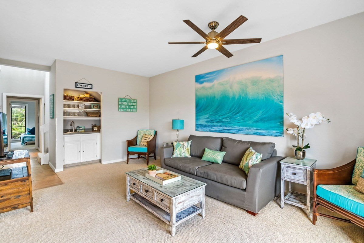 2370 Ho'ohu Road, Unit 522 Koloa, HI 96756 - Photo 11 of 29 a living room with furniture and a large window