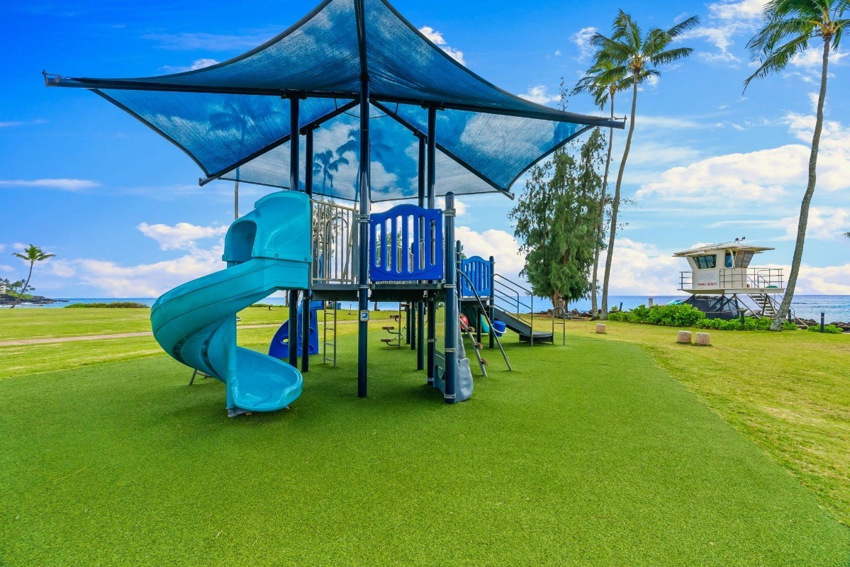 2370 Ho'ohu Road, Unit 522 Koloa, HI 96756 - Photo 26 of 29 a view of a backyard with swimming pool