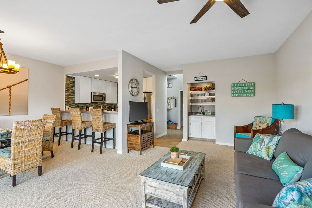 2370 Ho'ohu Road, Unit 522 Koloa, HI 96756 - Photo 3 of 29 a living room with furniture and a table