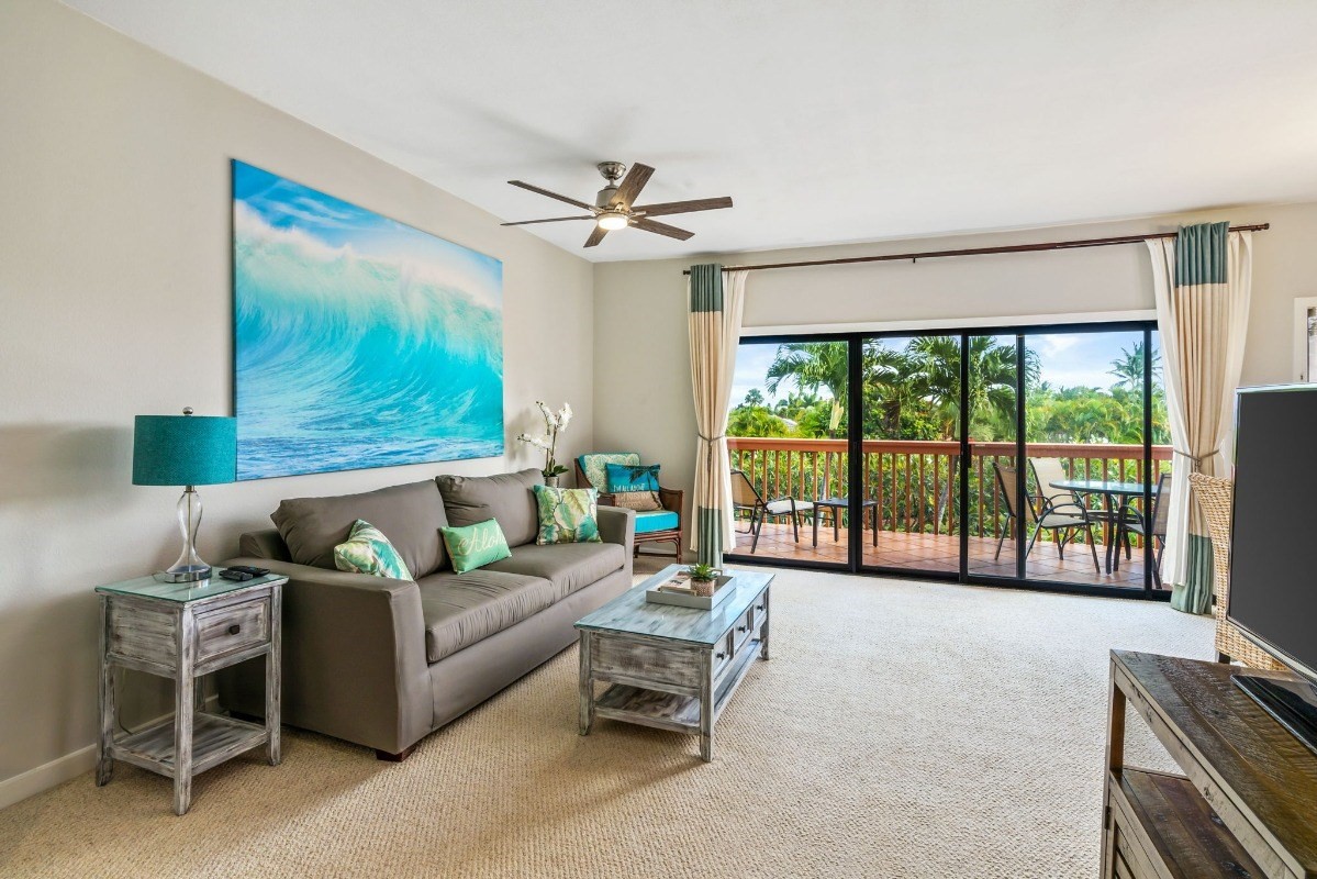 2370 Ho'ohu Road, Unit 522 Koloa, HI 96756 - Photo 8 of 29 a living room with furniture and a flat screen tv