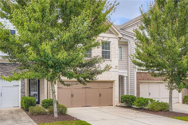 a front view of a house with a garage