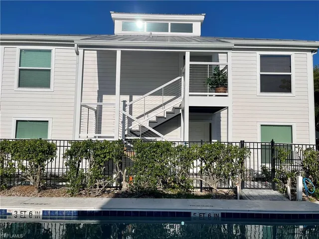 a dining room with furniture and a window