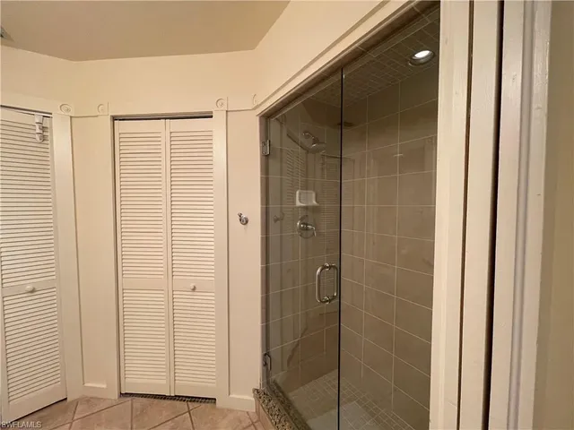 a bathroom with a double vanity sink and mirror