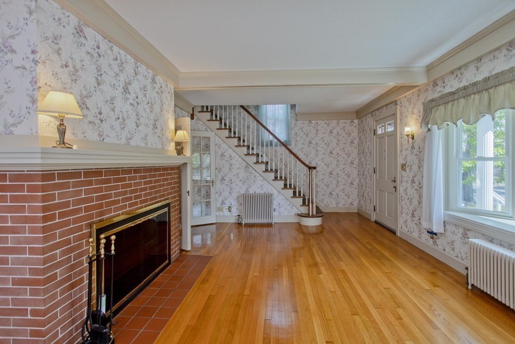 144 Pasco Road Springfield, MA 01151 - Photo 20 of 42 a view of an empty room with wooden floor and a window