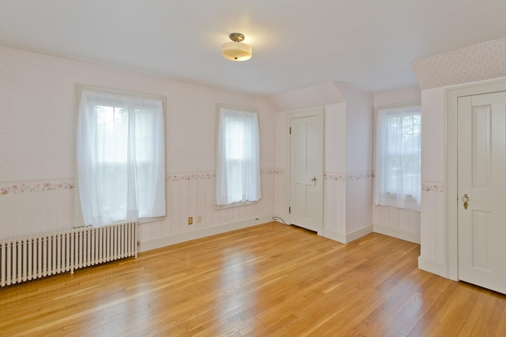 144 Pasco Road Springfield, MA 01151 - Photo 25 of 42 a view of an empty room with wooden floor and a window