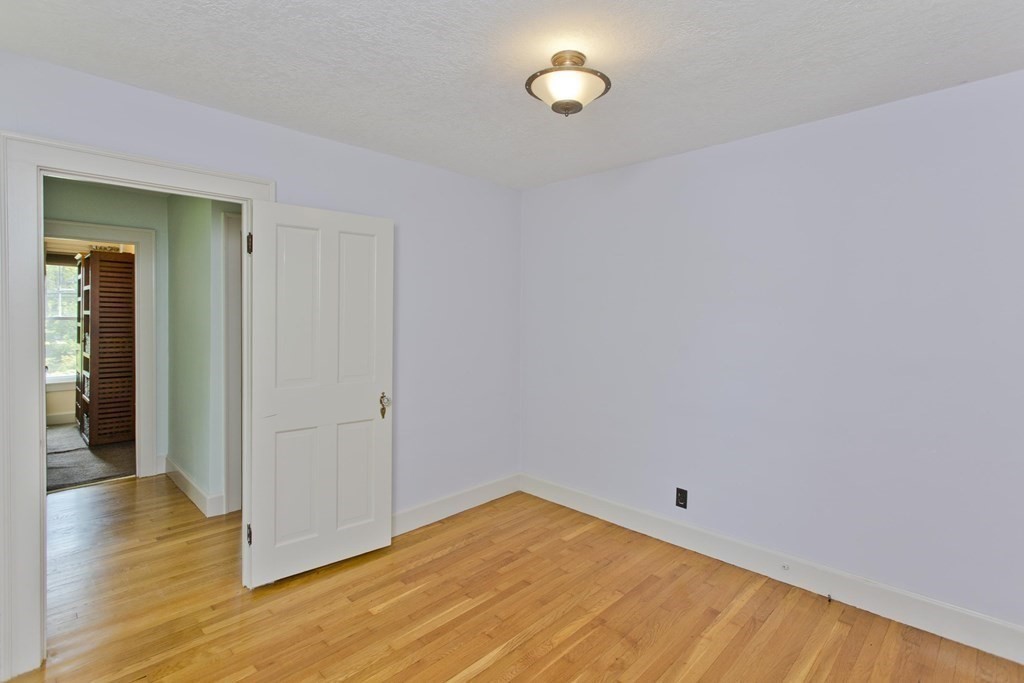 144 Pasco Road Springfield, MA 01151 - Photo 27 of 42 a view of empty room with wooden floor