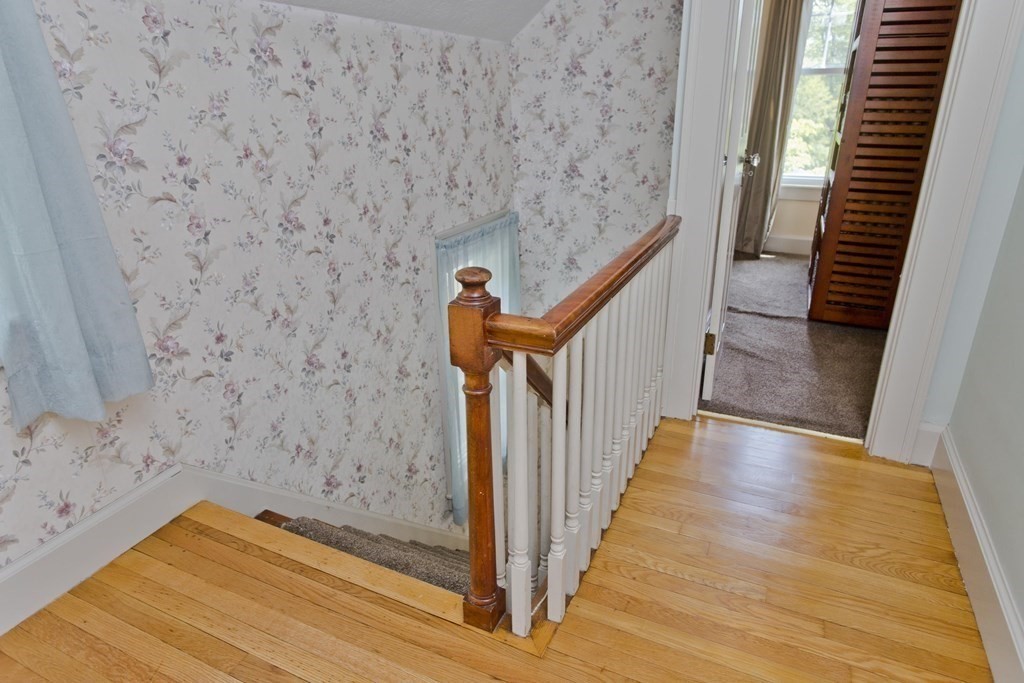 144 Pasco Road Springfield, MA 01151 - Photo 29 of 42 a view of a hallway with wooden floor and stairs