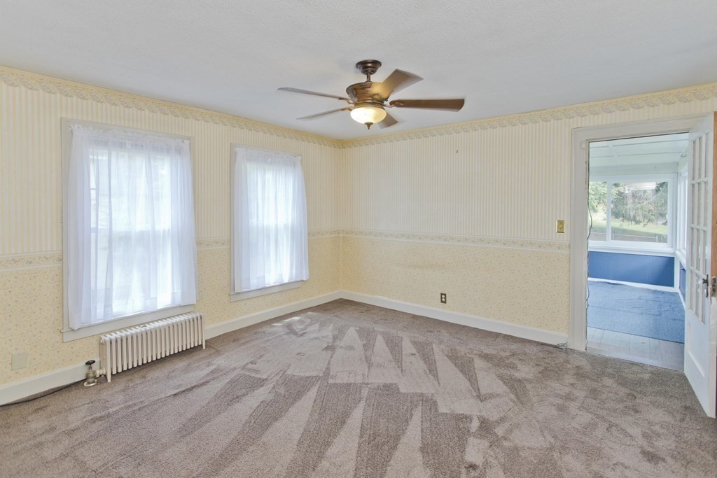 144 Pasco Road Springfield, MA 01151 - Photo 34 of 42 wooden floor in an empty room with a window