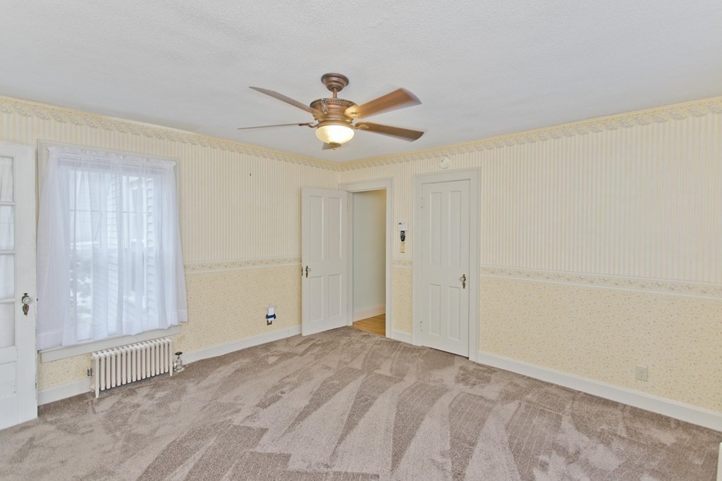 144 Pasco Road Springfield, MA 01151 - Photo 36 of 42 a view of empty room with window and ceiling fan