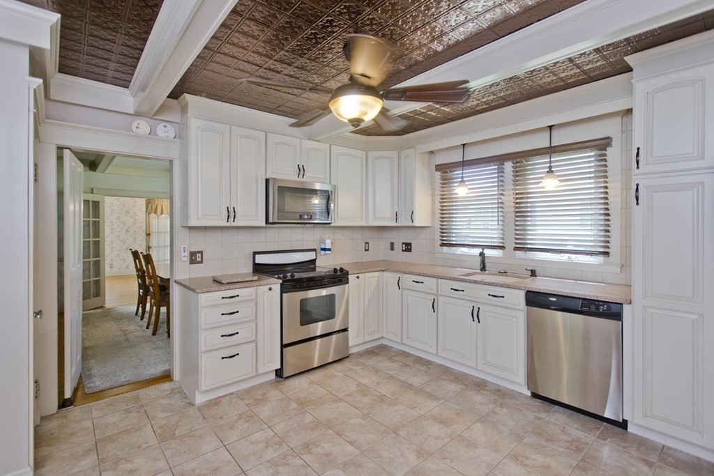 144 Pasco Road Springfield, MA 01151 - Photo 5 of 42 a kitchen with granite countertop a sink stainless steel appliances and cabinets