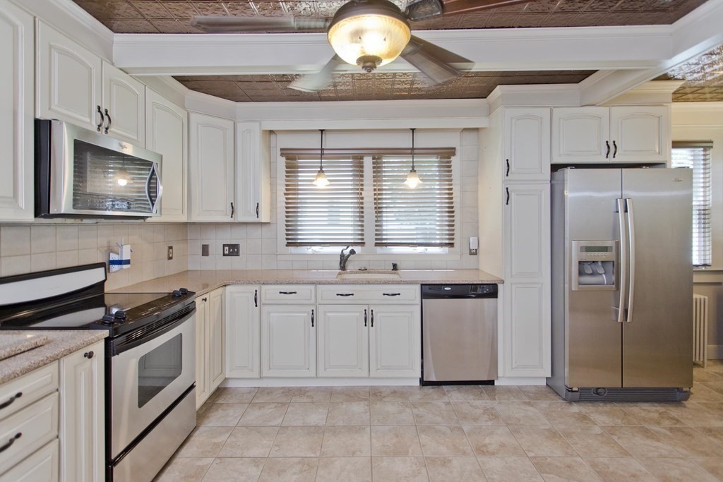 144 Pasco Road Springfield, MA 01151 - Photo 8 of 42 a kitchen with stainless steel appliances a stove sink and refrigerator