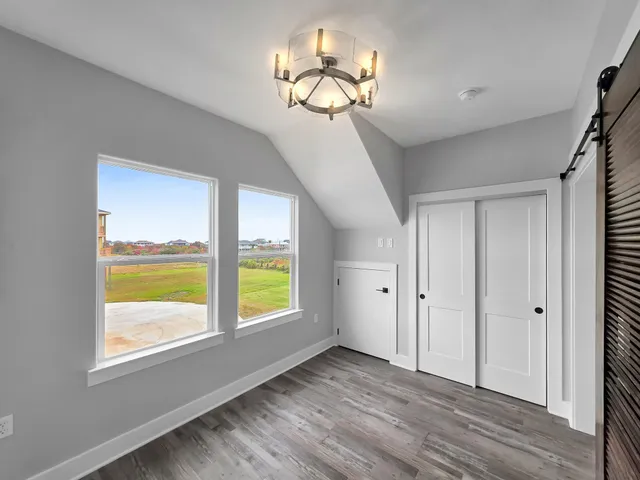 a view of wooden floor and chandelier in a room