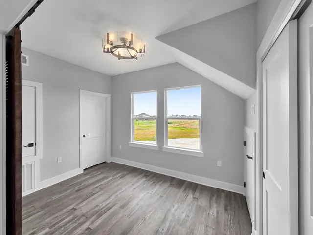 a large kitchen with a large counter top appliances and cabinets