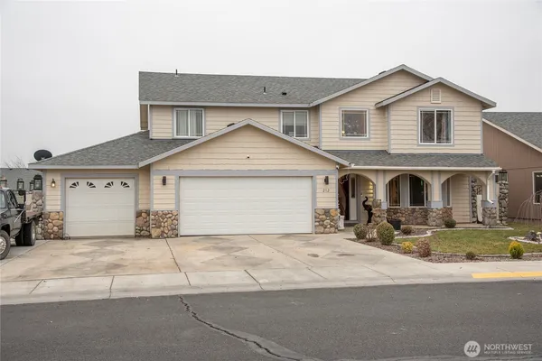 a front view of a house with yard