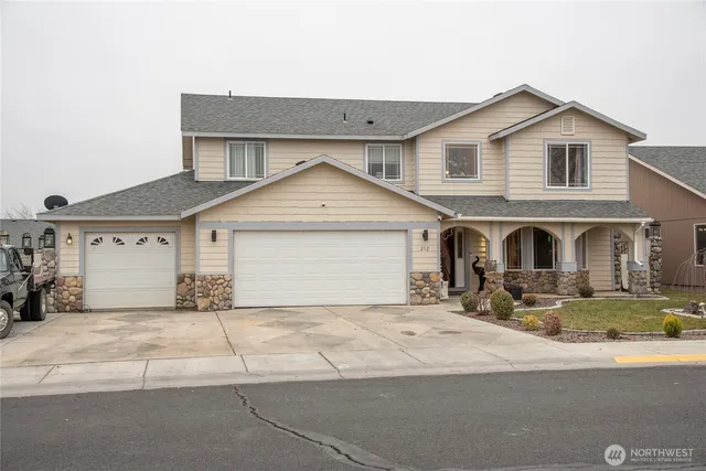 a front view of a house with yard
