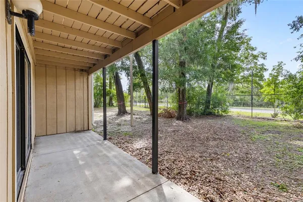a view of a room with a big yard